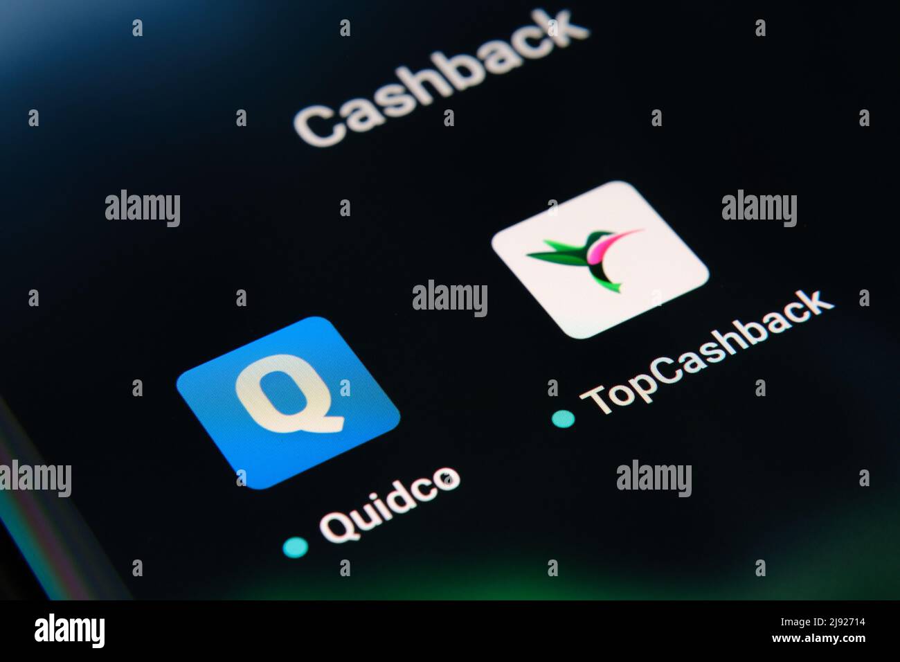 Corner of smartphone with Quidco and TopCashback apps. Concept for competition. Stafford, United Kingdom, May 19, 2022. Stock Photo