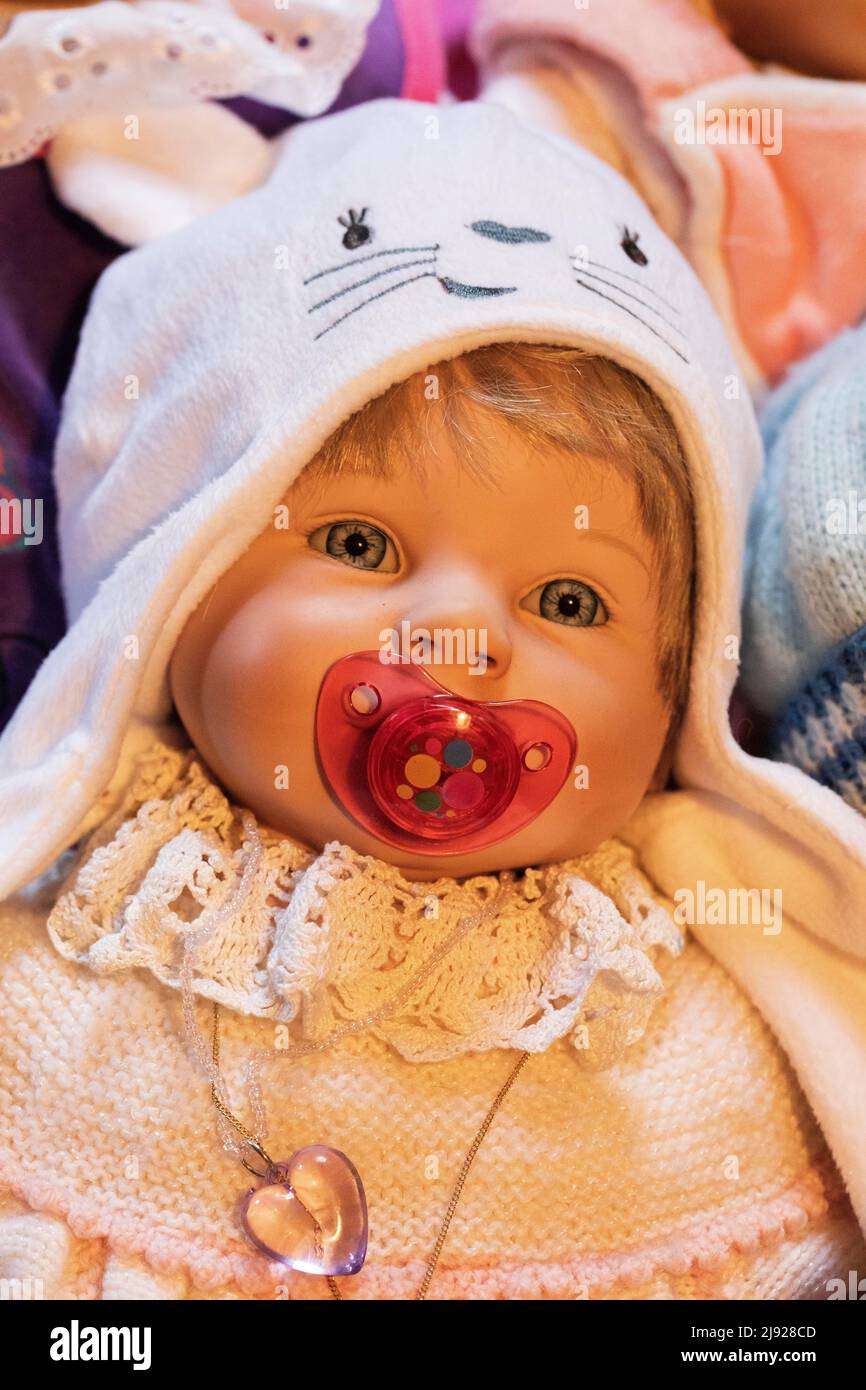 Portrait of an old decorative baby doll, children's toy, symbolic image, Austria Stock Photo