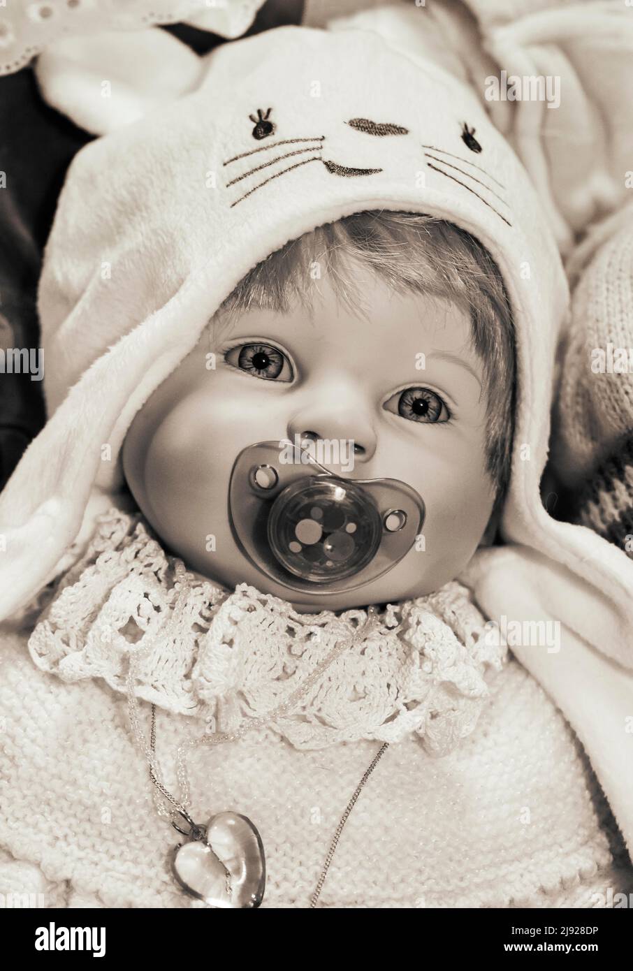 Sepia colours, portrait of an old decorative baby doll, children's toy, symbolic image, Austria Stock Photo