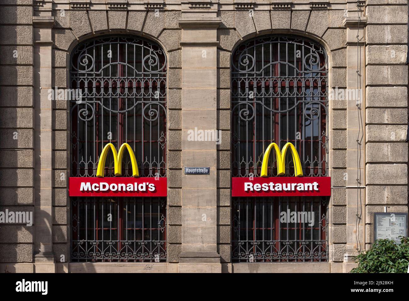 Mc Donald logos on the windows of a historic post office building, Erlangen, Middle Franconia Bavaria, Germany Stock Photo