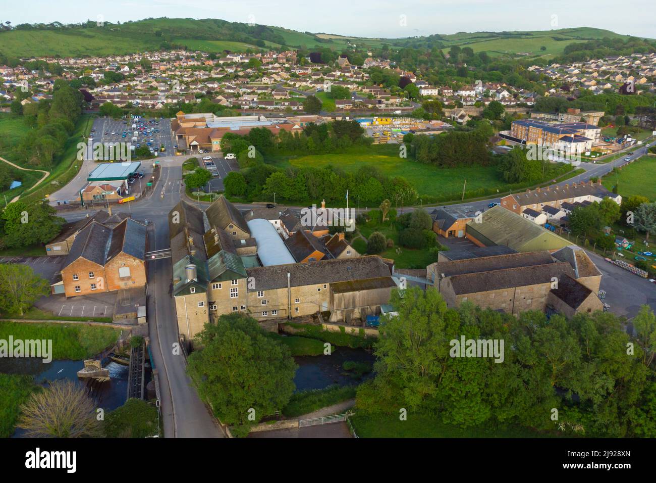 General view from the air of the historic JC & RH Palmers Ltd The Old Brewery which sits next to the river Brit at Bridport in Dorset.  The brewery wa Stock Photo