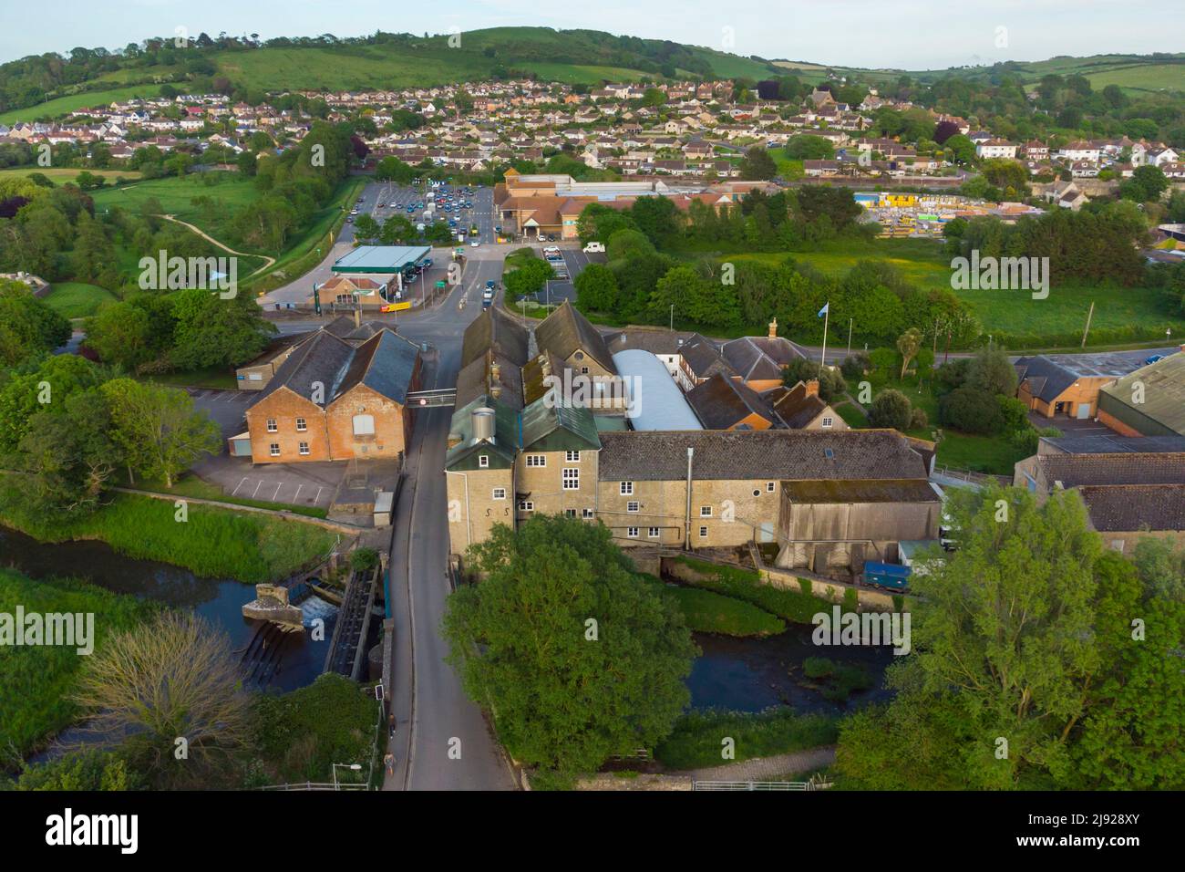 General view from the air of the historic JC & RH Palmers Ltd The Old Brewery which sits next to the river Brit at Bridport in Dorset.  The brewery wa Stock Photo