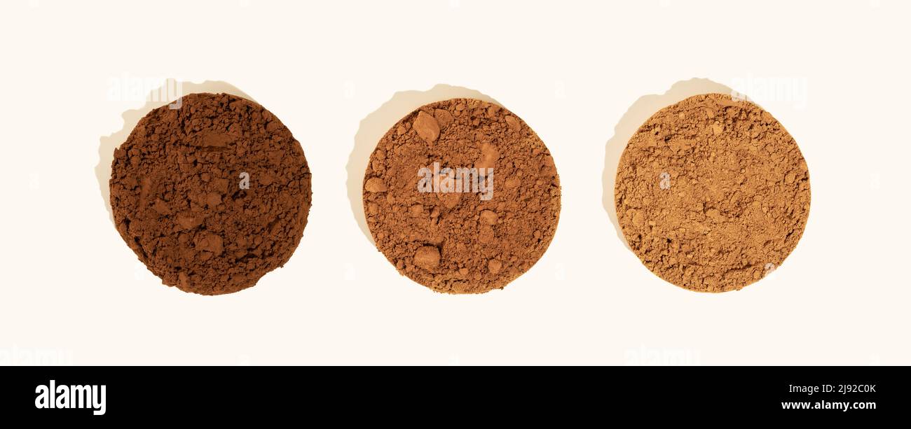 Comparison of dutch process cocoa with natural cocoa powder.Three piles ...