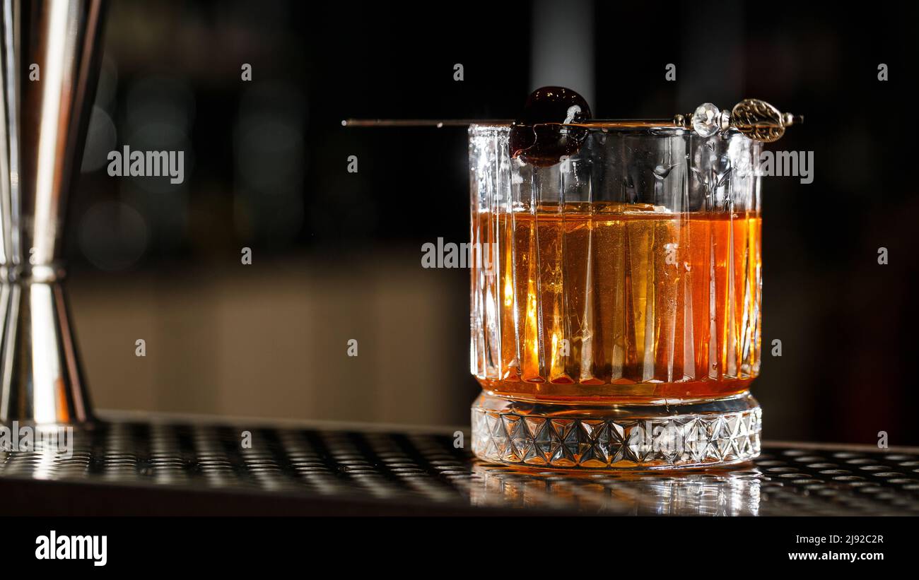 Old fashioned cocktail, consisting of Bourbon, Angostura Bitter, sugar