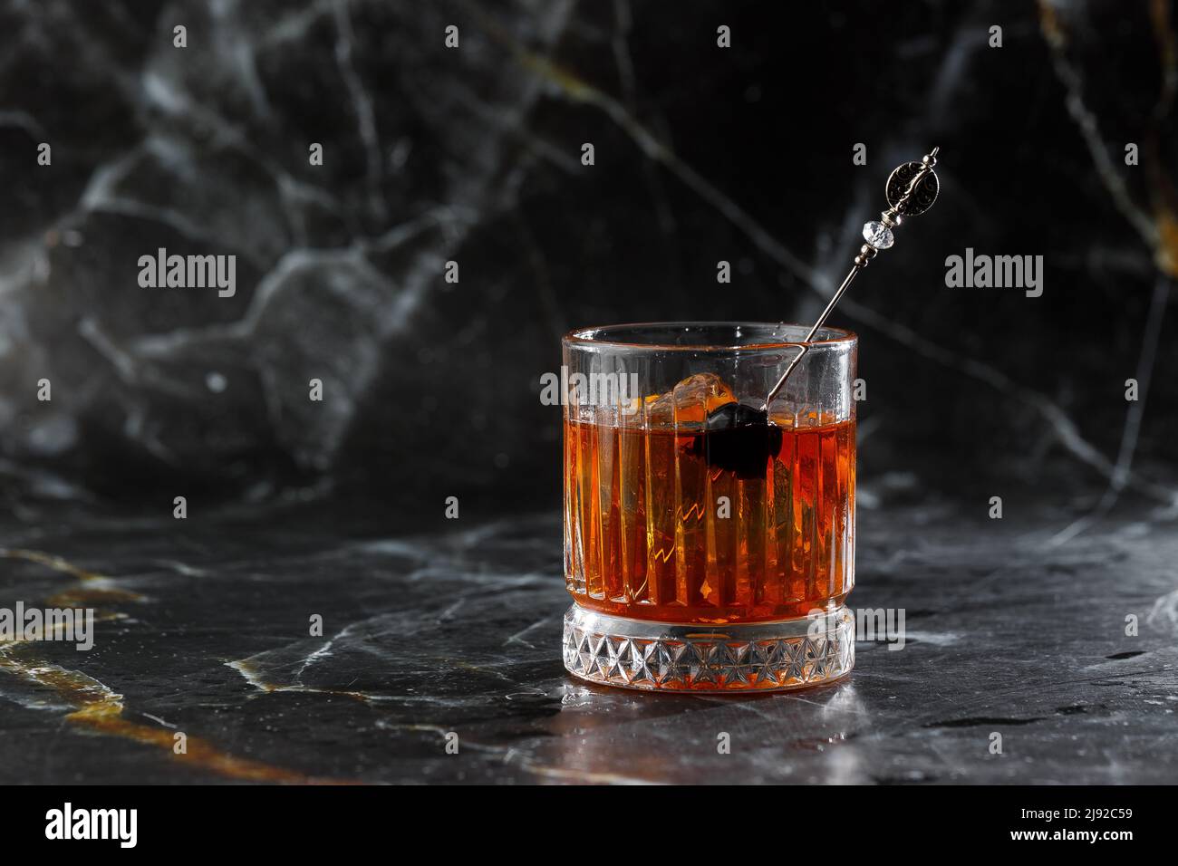 Old fashioned cocktail, consisting of Bourbon, Angostura Bitter, sugar