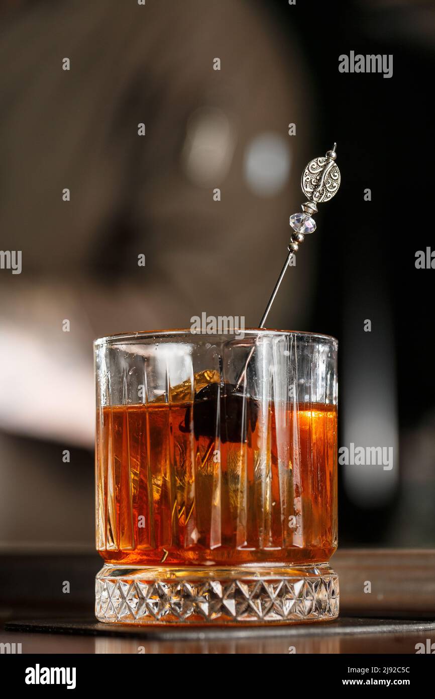 Old fashioned cocktail, consisting of Bourbon, Angostura Bitter, sugar