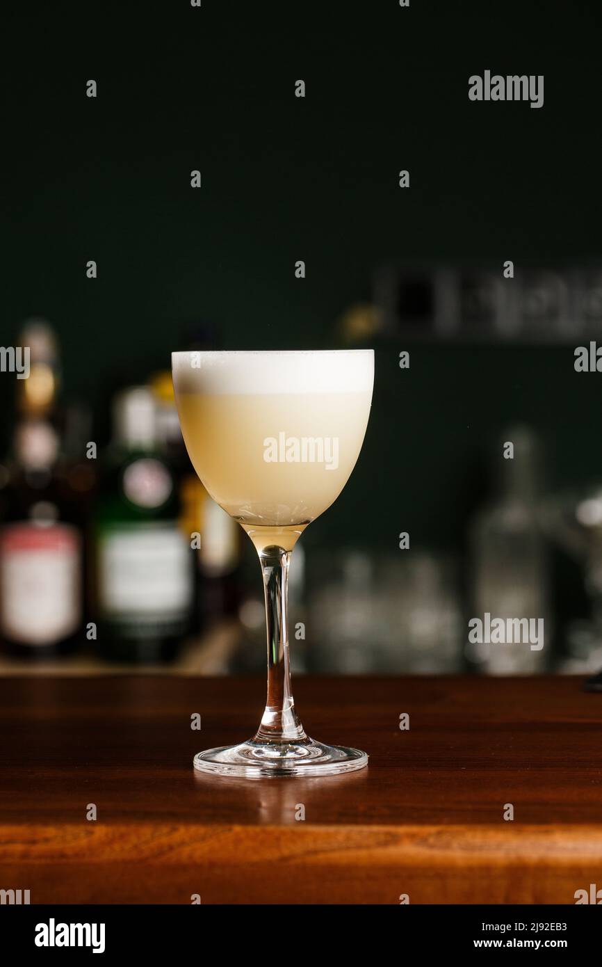 Pisco sour cocktail whiskey with lime, egg white, sugar syrup in