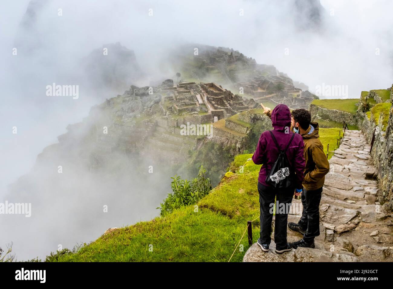 Young Visitors To Machu Picchu, Urubamba Province, Peru. Stock Photo