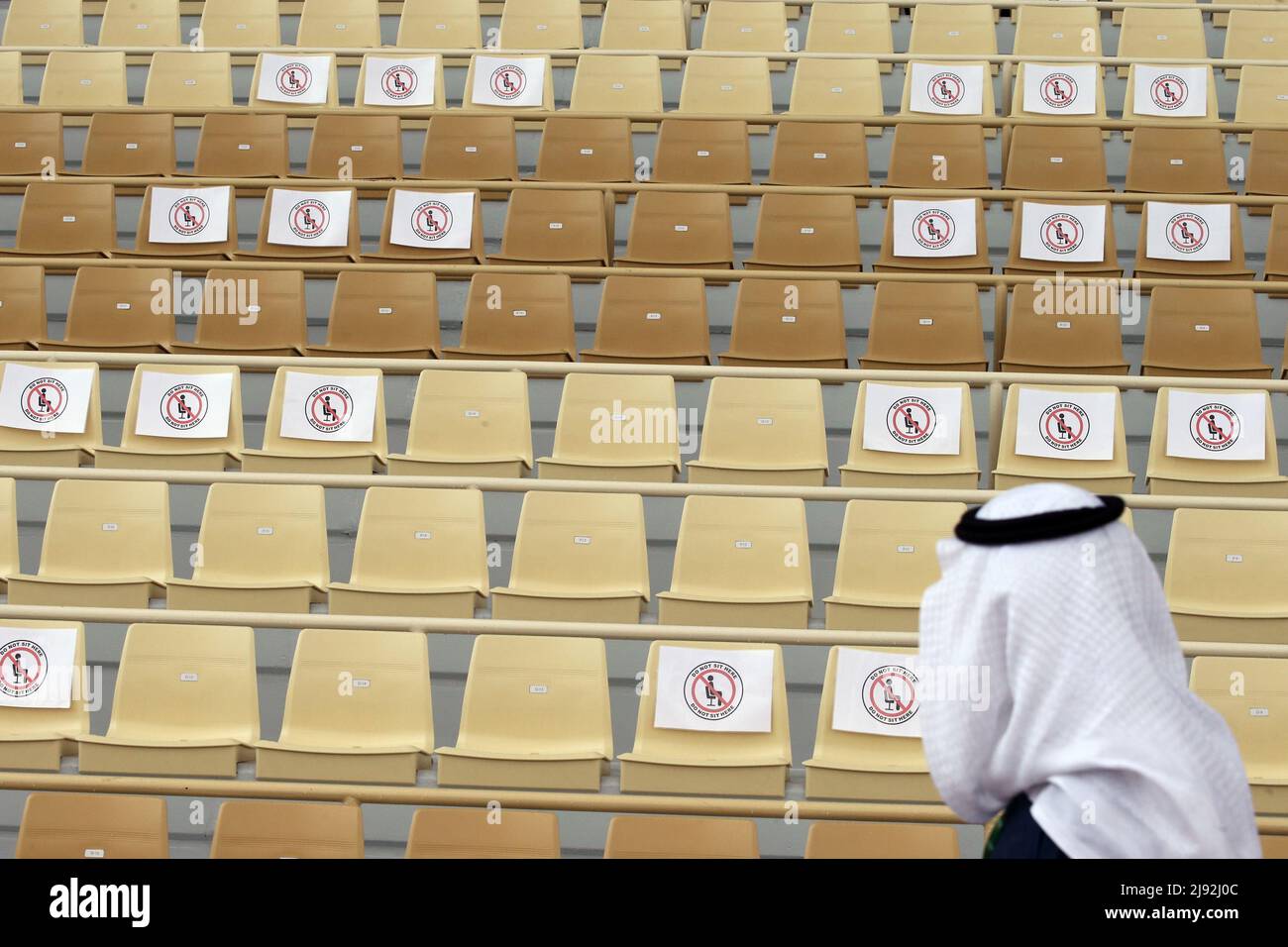 20.02.2021, Riad, Riyadh, Saudi Arabia - Seats on the grandstand of the racecourse are marked with regard to the safety distance because of the corona Stock Photo