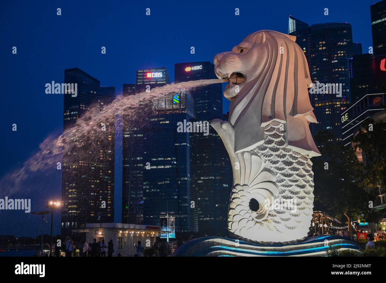 Merlion Park, a iconic statue in Singapore at Night. Merlion is a mythical creature with a lion's head and the body of a fish Stock Photo