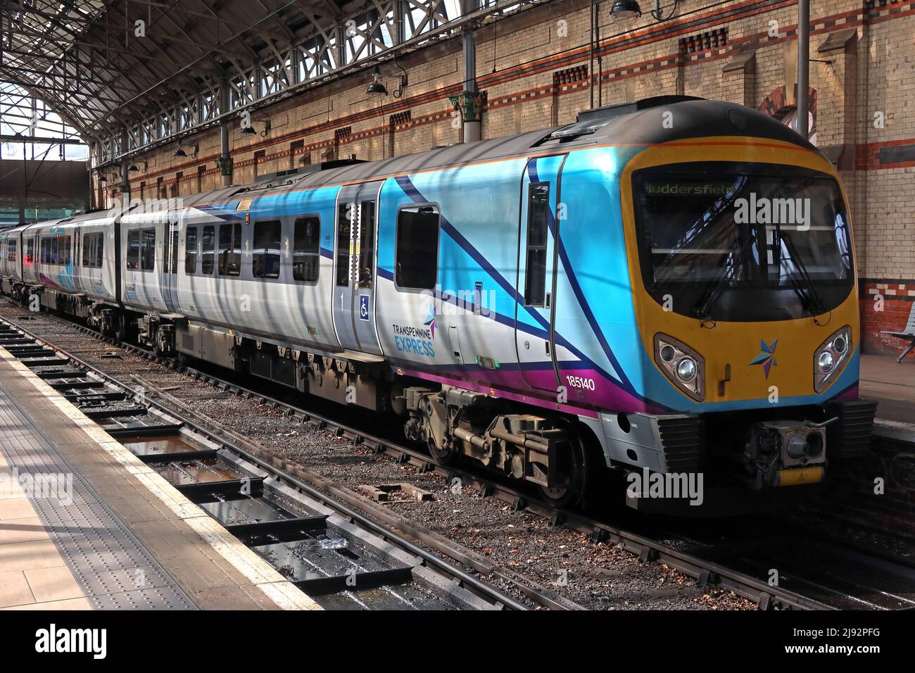 Transpennine express DMU train 185140 for Huddersfield - Piccadilly NPR train station, public transport rail services from Manchester Stock Photo