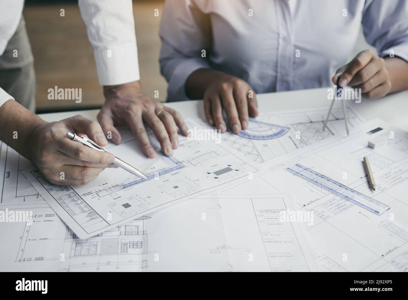 The partnership engineering man or coworkers working on a project and discussing together with