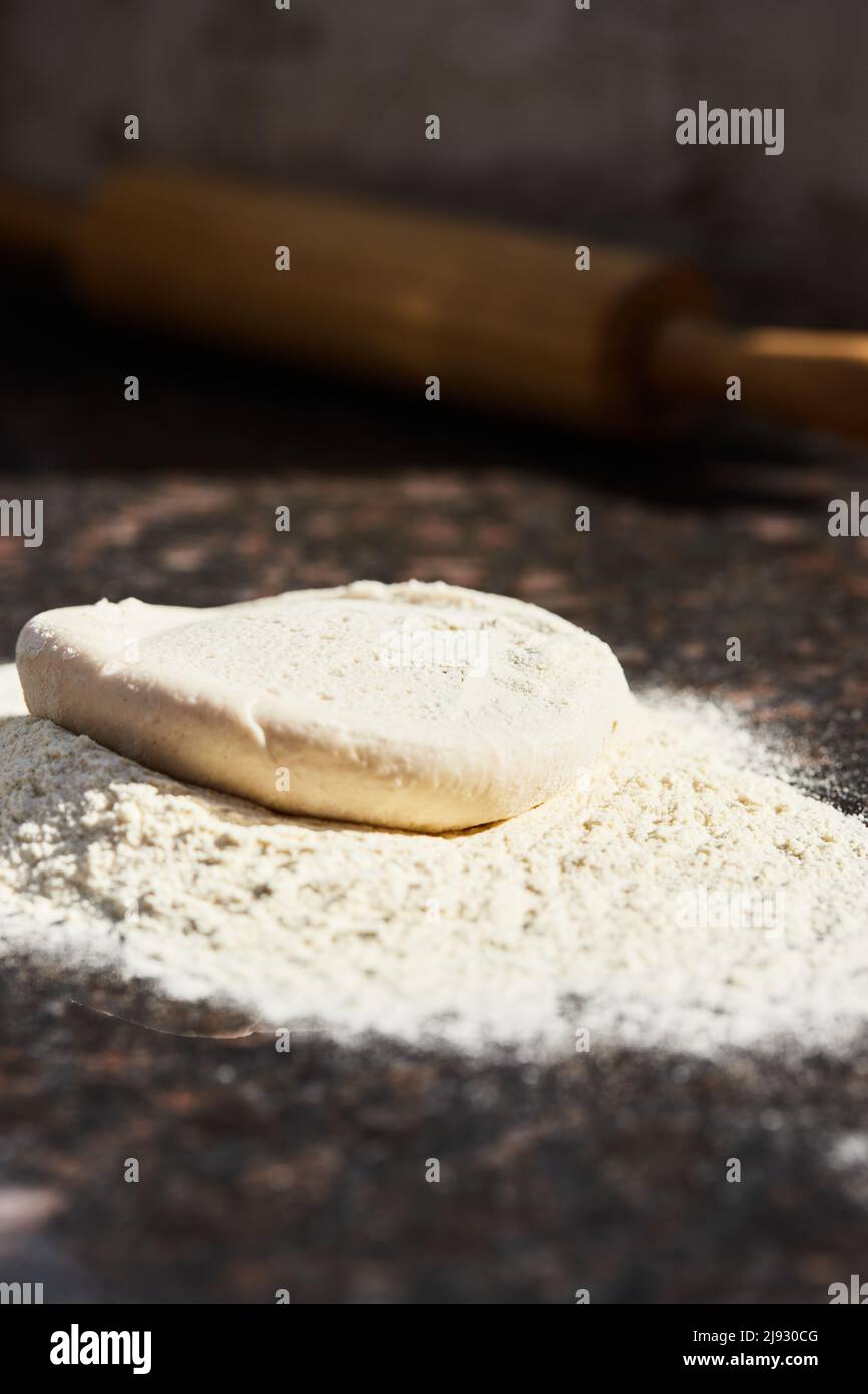 Pizza dough before rolling into a circle. The process of making
