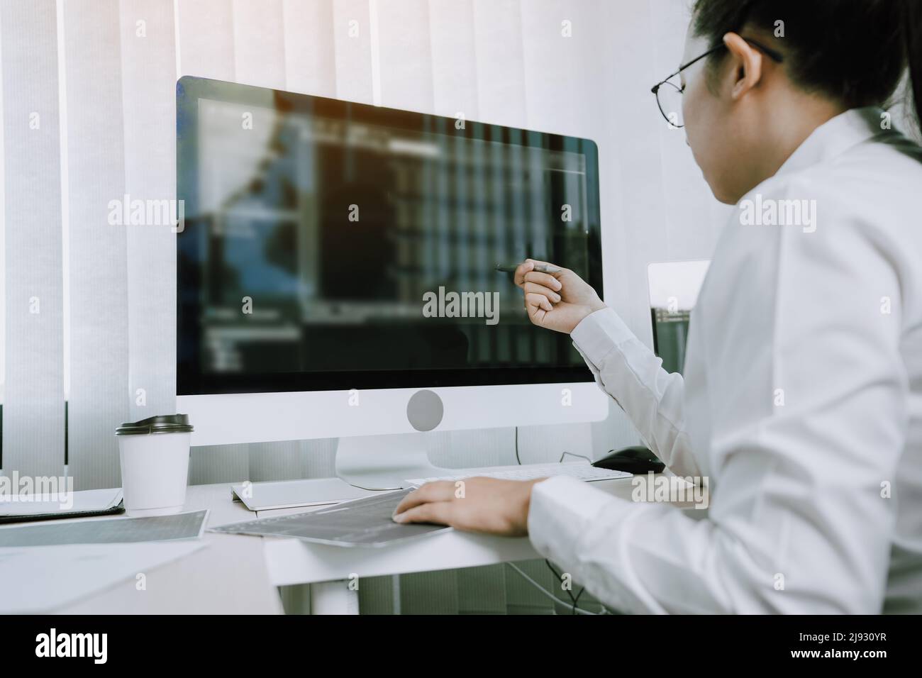 Developing programming and coding technology working in a software engineers developing applications in office. Stock Photo