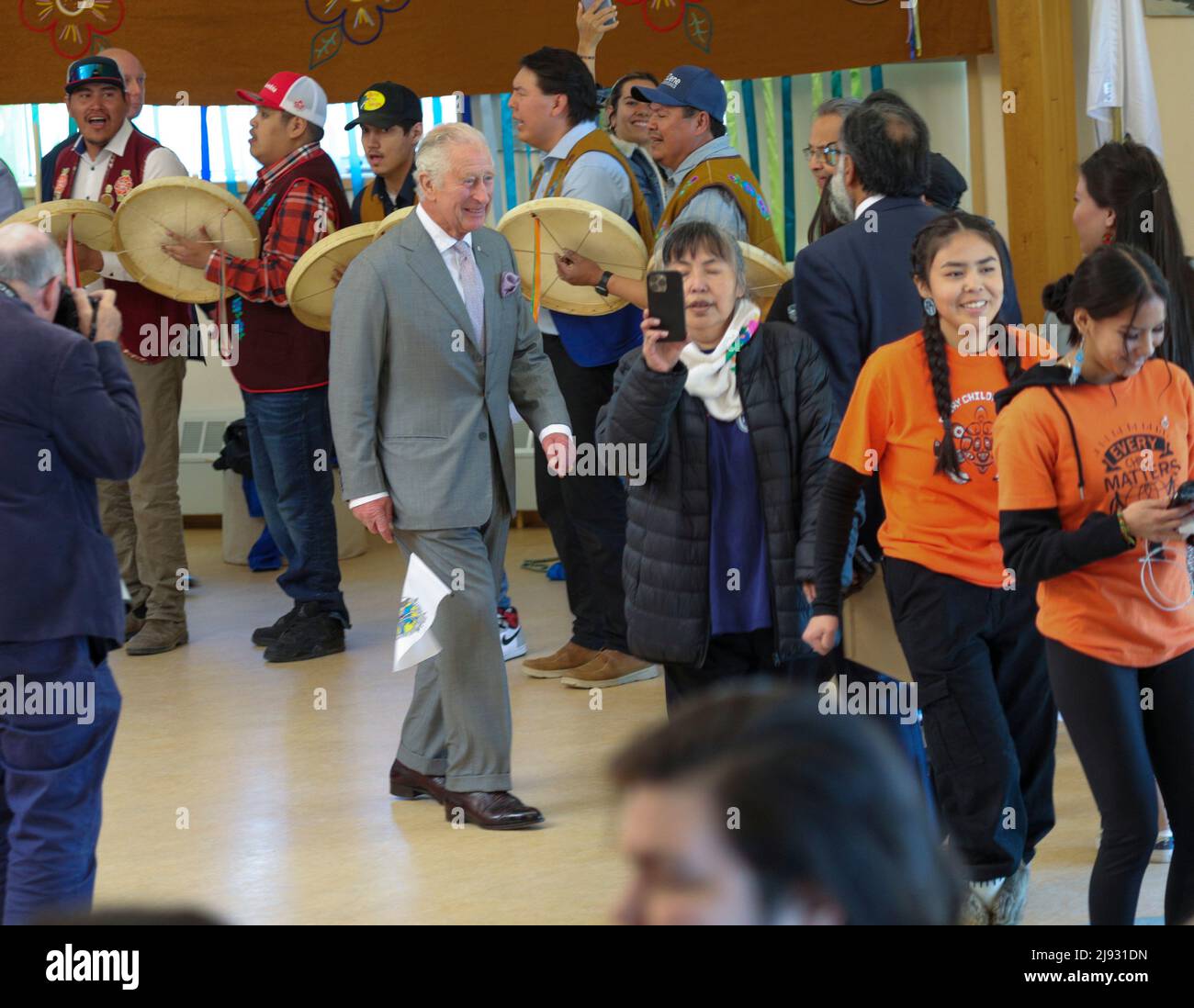 An enthusiastic crowd of Yellowknives Dene cheered Prince Charles when he joined their circle in a traditional drum dance at Dettah, Northwest Territories on Thursday, May 19, 2022. THE CANADIAN PRESS/Bill Braden Stock Photo