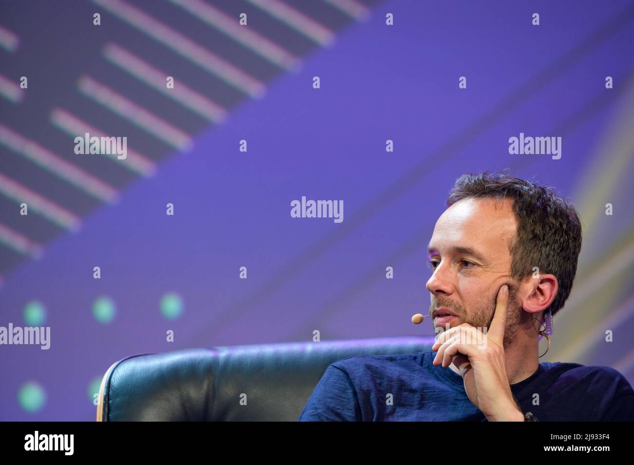 Hamburg, Germany. 18th May, 2022. OMR CEO Philipp Westermeyer sits in a chair on stage. The OMR digital festival in Hamburg focuses on a combination of trade fair, workshops and party. Credit: Jonas Walzberg/dpa/Alamy Live News Stock Photo