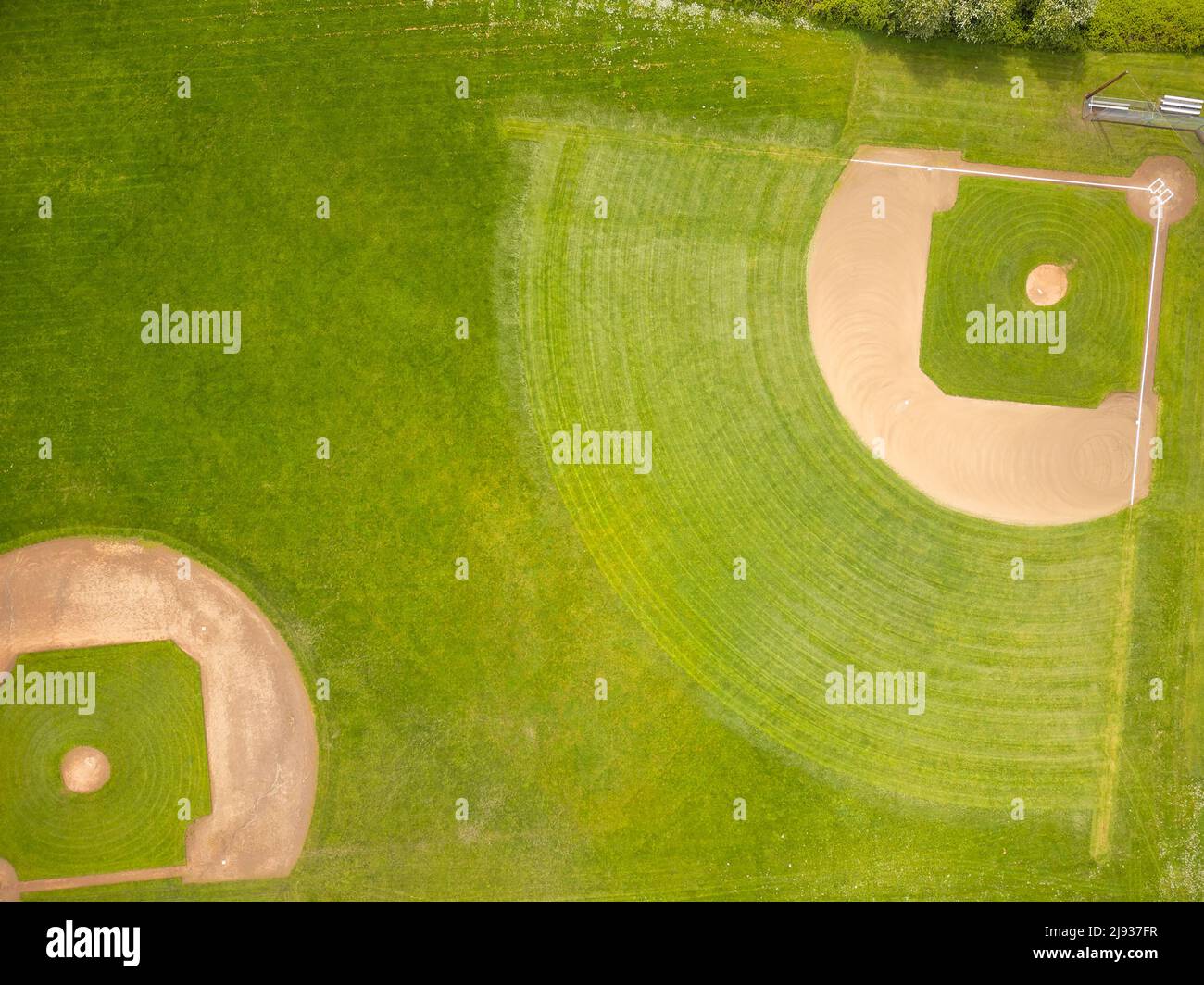 View from above. Green sports field, stadium, lawn. Sports games, training, matches. Abstraction. Minimalism. Advertising, banner, invitation. There a Stock Photo