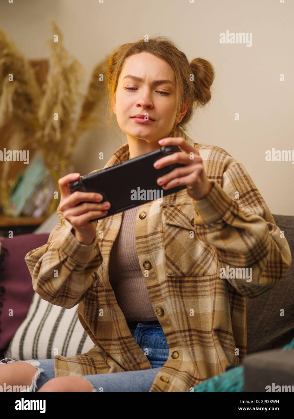 Woman sitting in a car and playing a Pokemon Go game Stock Photo - Alamy