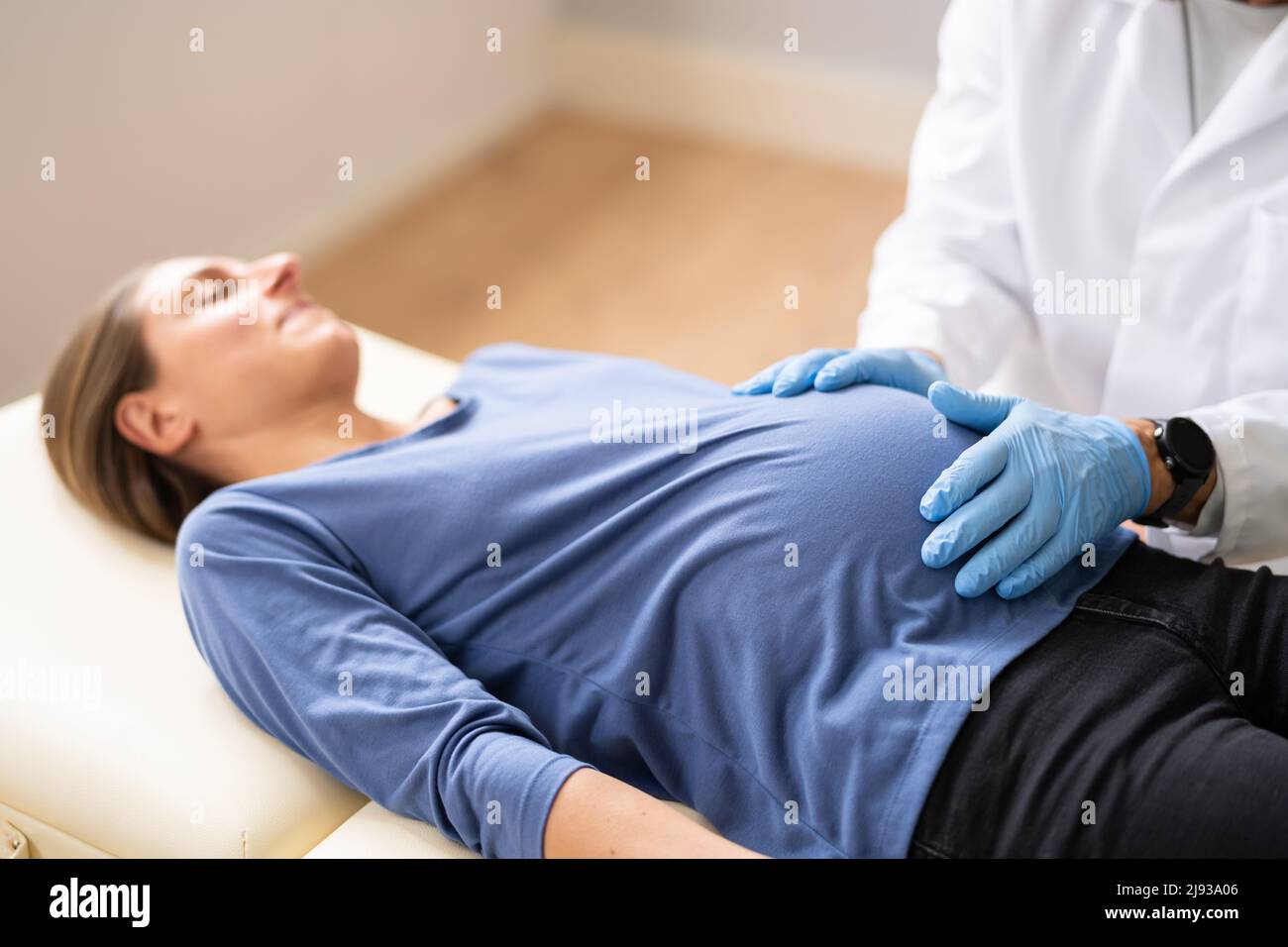 Pregnant Woman At Chiropractor. Baby Breech Physiotherapy And Pregnancy Stock Photo