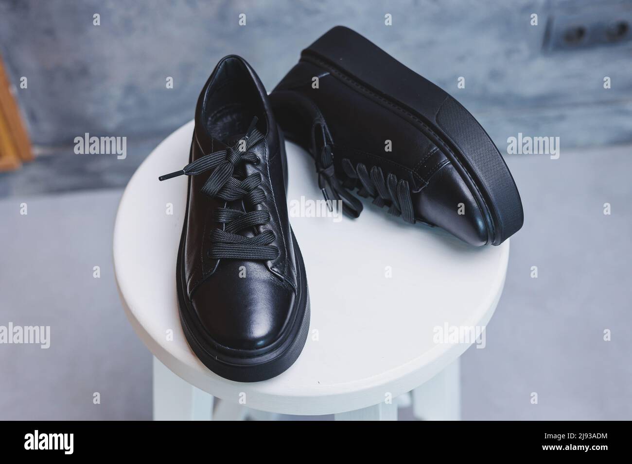 Black leather classic sneakers with laces. Casual women s style