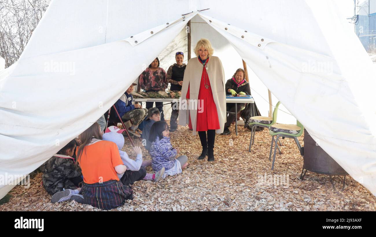 Duchess of Cornwall is shown demonstrations of fish scale artwork and fish drying with pupils from Kaw Tay Whee School in Yellowknife, during the three-day trip to Canada to mark the Queen's Platinum Jubilee. Picture date: Thursday May 19, 2022. Stock Photo