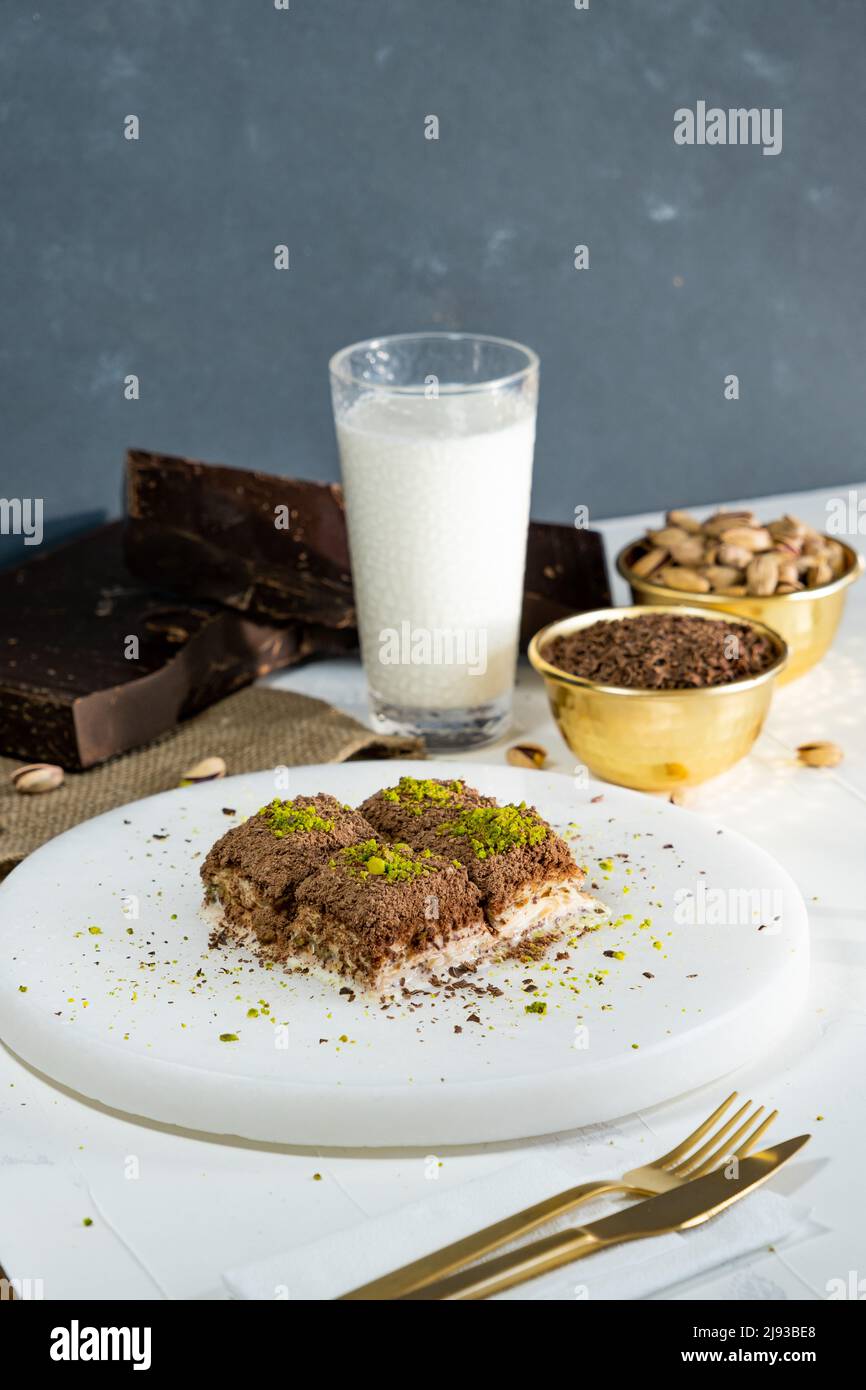 Pistachio cold baklava on white marble. Traditional middle eastern