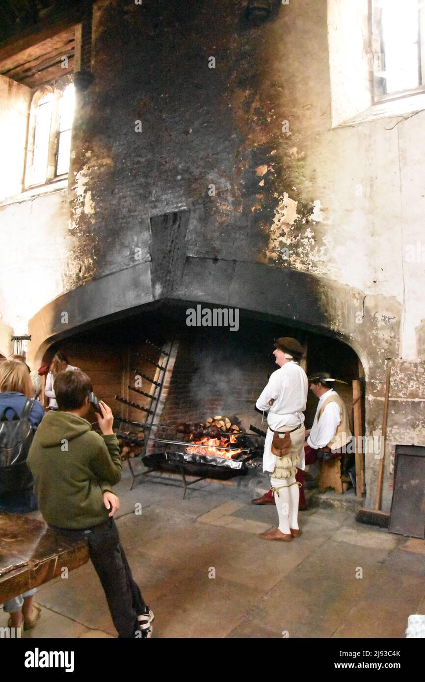 Roasting meat in King Henry VIII's Kitchens, Hampton Court Palace, Richmond, London, England. Stock Photo