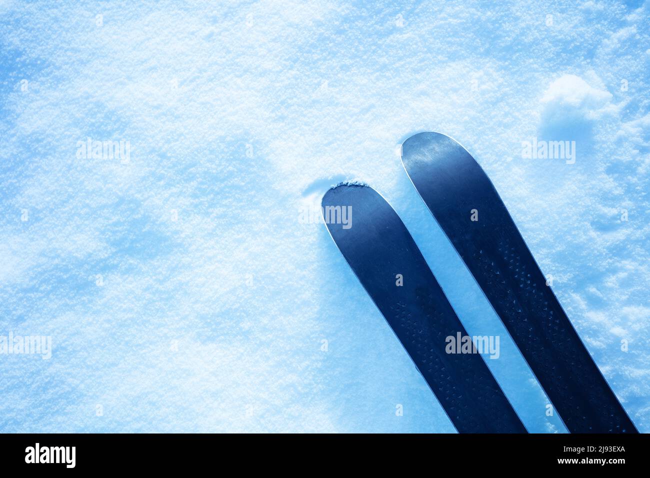 Pair of mountain alpine ski in the snow view from above Stock Photo