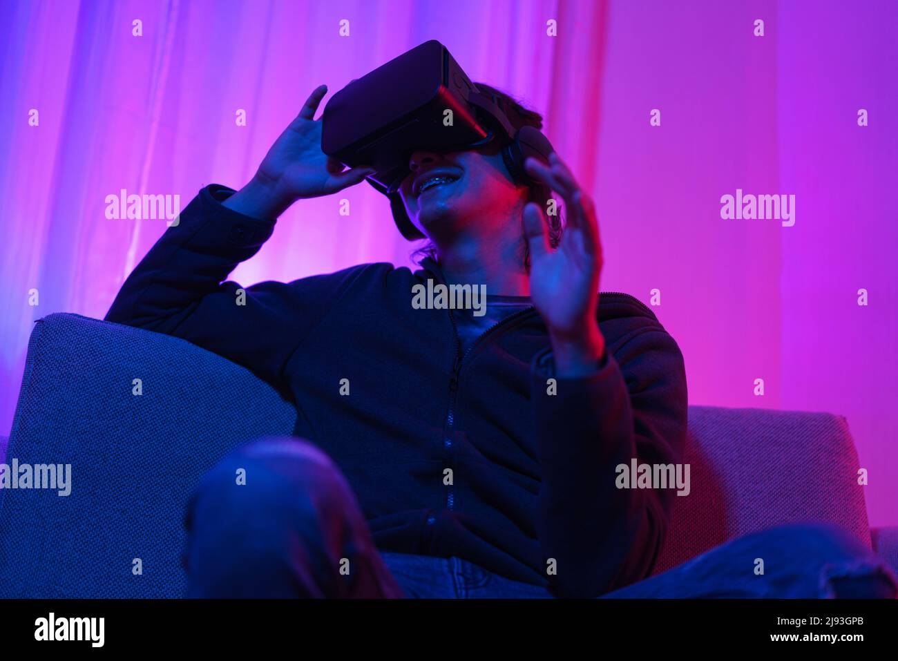 Metaverse technology concept, Man holding VR goggles and pointing to