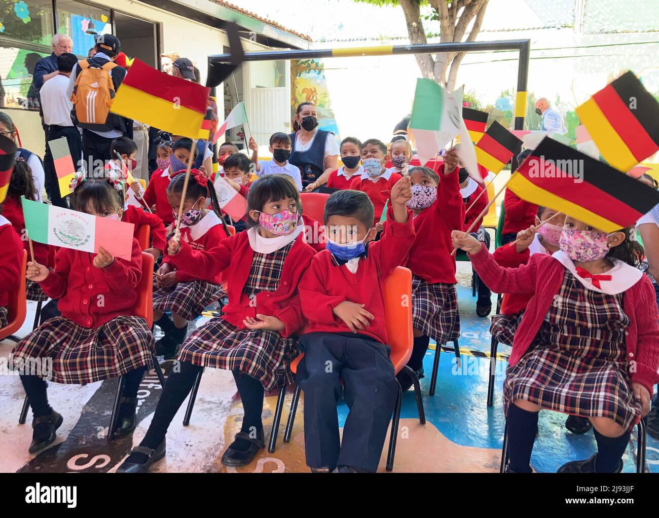 Queretaro, Mexico. 20th May, 2022. Children from the Casa de Cuna orphanage in Queretaro wave German and Mexican flags. The then DFB treasurer and later president Egidius Braun had visited the orphanage in 1986 and was moved by the misery there. Together with the national players Völler and Toni Schumacher as well as team manager Franz Beckenbauer, he returned and eventually founded the "Mexico Aid", which is now called the "Egidius Braun Foundation". (to dpa: "Moved Völler visits orphanage in Mexico: "Braun would be proud"") Credit: Holger Schmidt/dpa/Alamy Live News Stock Photo