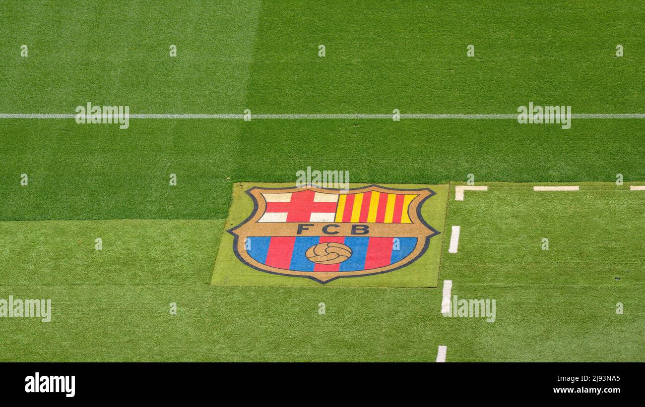 Grass of the Camp Nou football field with the FC Barcelona crest (Barcelona, Catalonia, Spain) ESP: Césped del campo de fútbol del Camp Nou y escudo Stock Photo