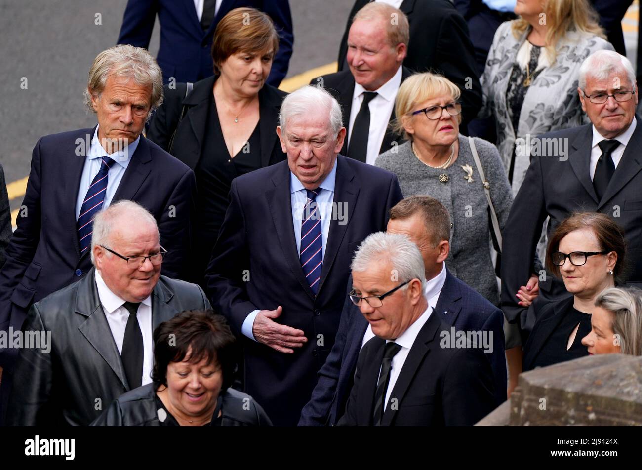 Former Rangers player John Greig (centre) arrives ahead of the funeral