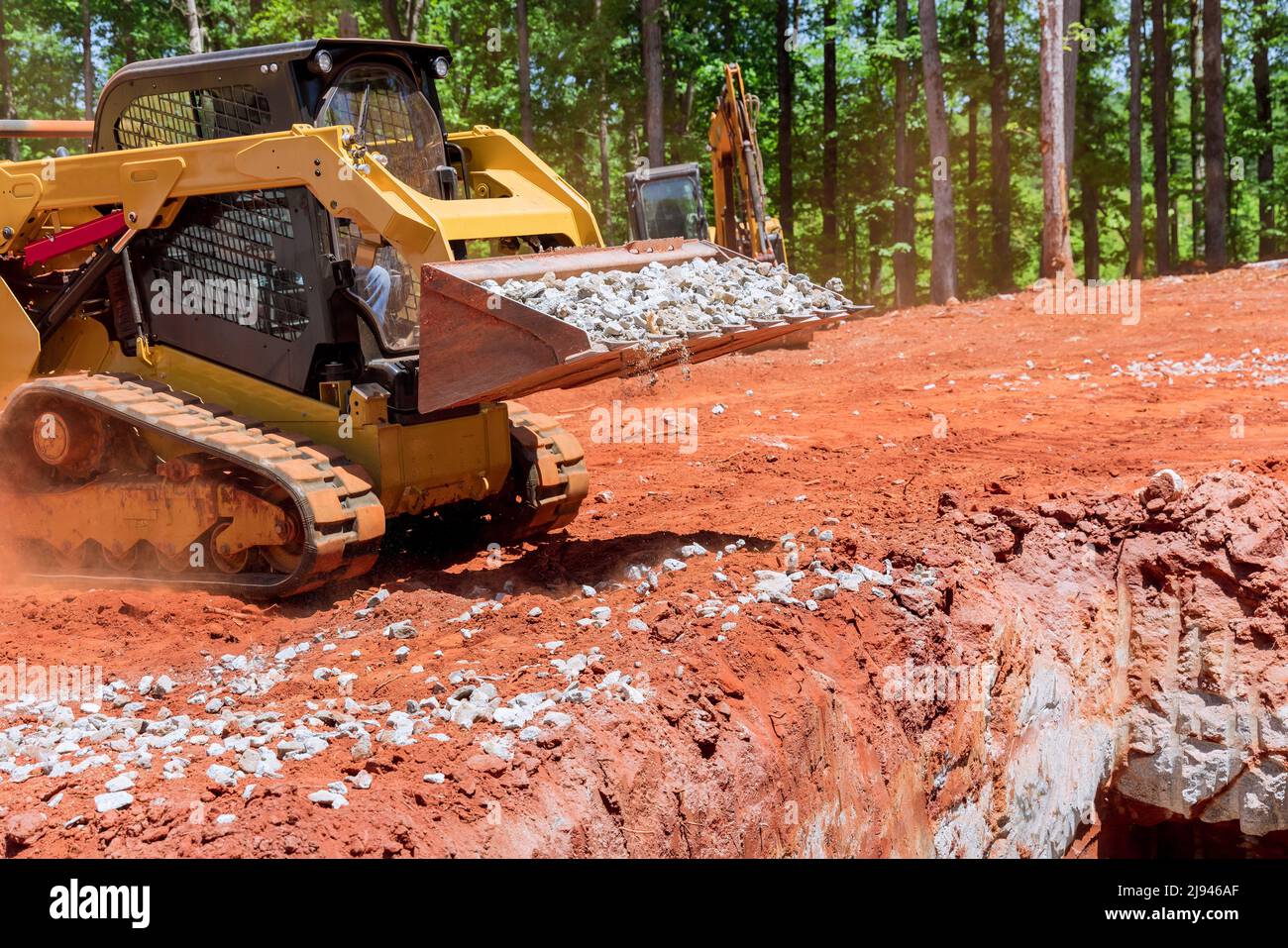 Industrial construction residential areas a small tractor of gravel moving Stock Photo