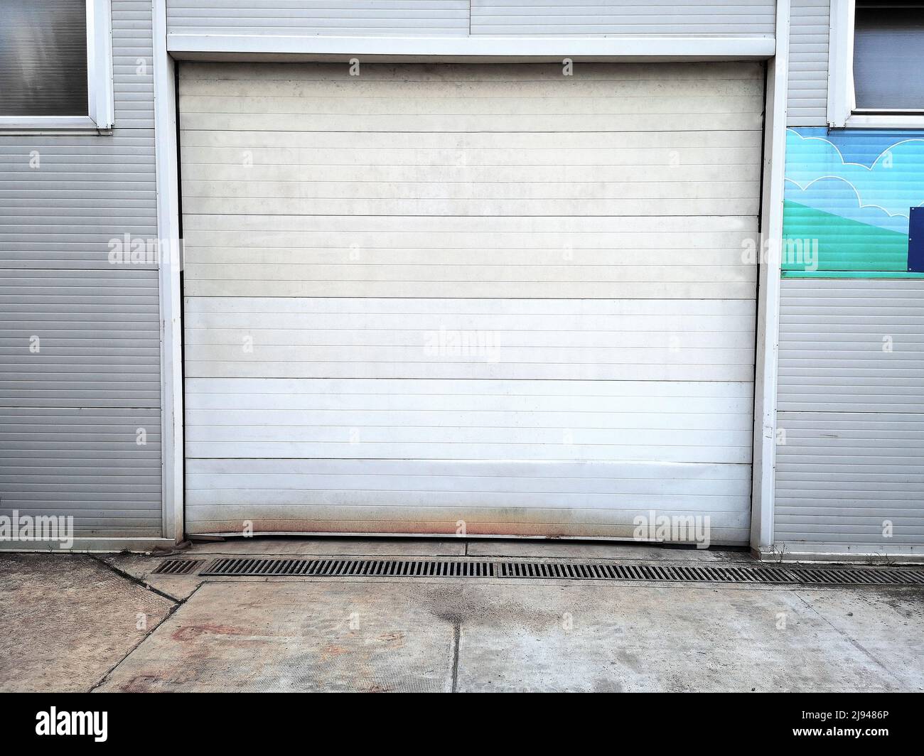 Grunge Old Metal Automatic Door on Rusty Exterior Panel Wall Background Stock Photo