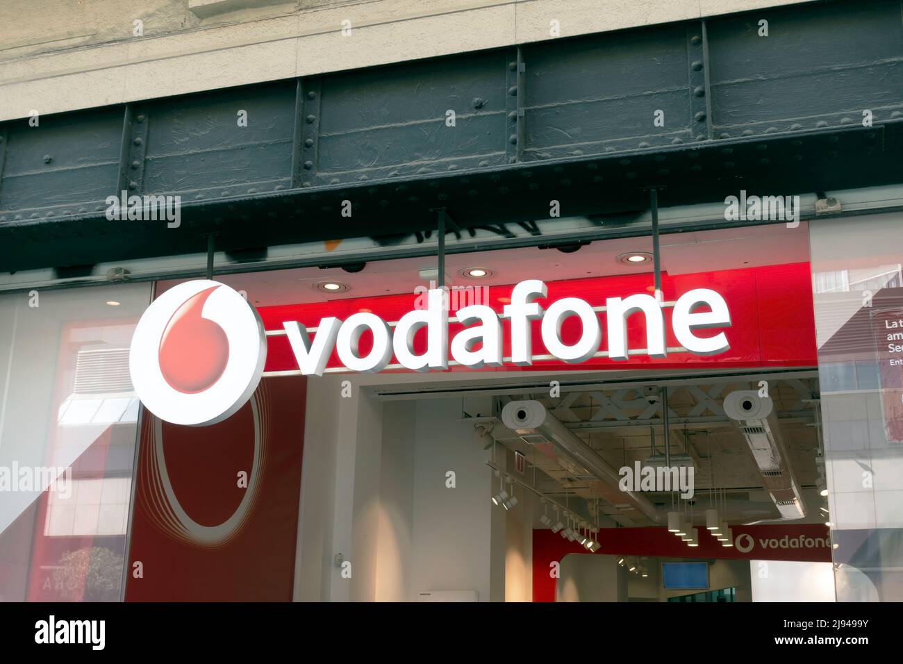 Barcelona, Spain - May 9, 2022, Vodafone shop sign. Vodafone is a British multinational telecommunications company. Stock Photo