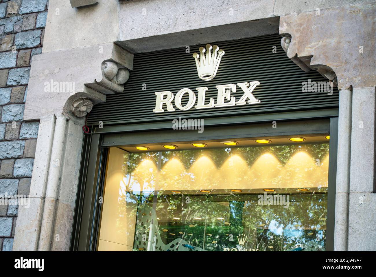 Barcelona, Spain - May 9, 2022: Rolex store sign. Rolex is a British-founded Swiss watch designer and manufacturer based in Geneva, Switzerland.. Stock Photo
