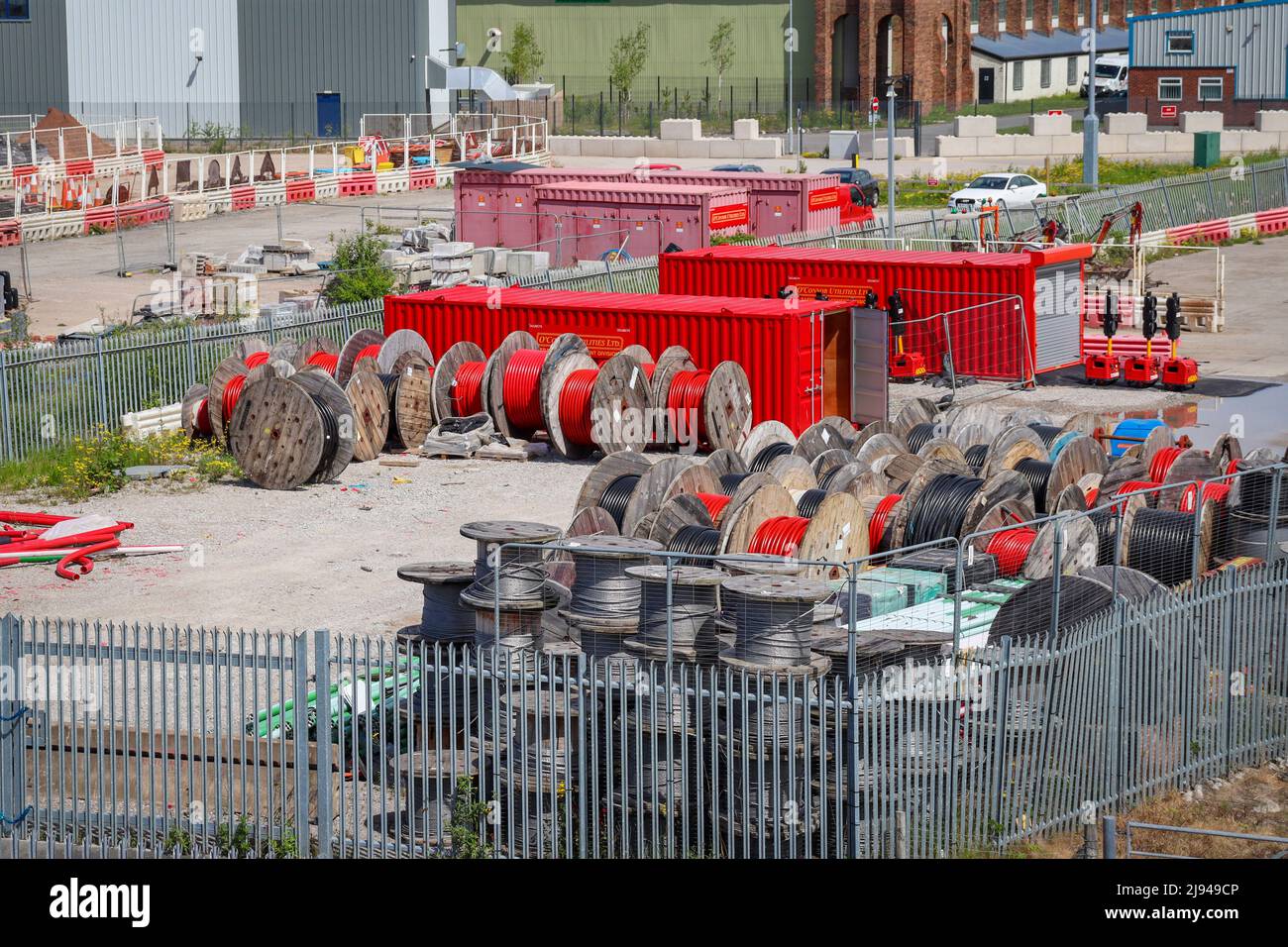 Industrial yard / estate with containers, wire cable reels / drums in red Stock Photo