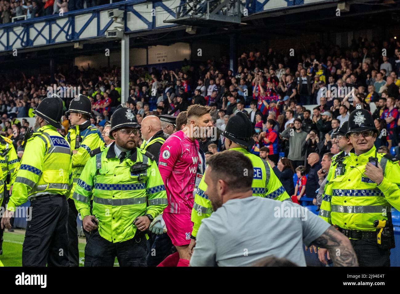 LIVERPOOL, ENGLAND - MAY 19: Jack Butland, Police and Everton fans run on pitch during the Premier League match between Everton and Crystal Palace at Goodison Park on May 19, 2022 in Liverpool, United Kingdom. (Photo by Sebastian Frej) Stock Photo