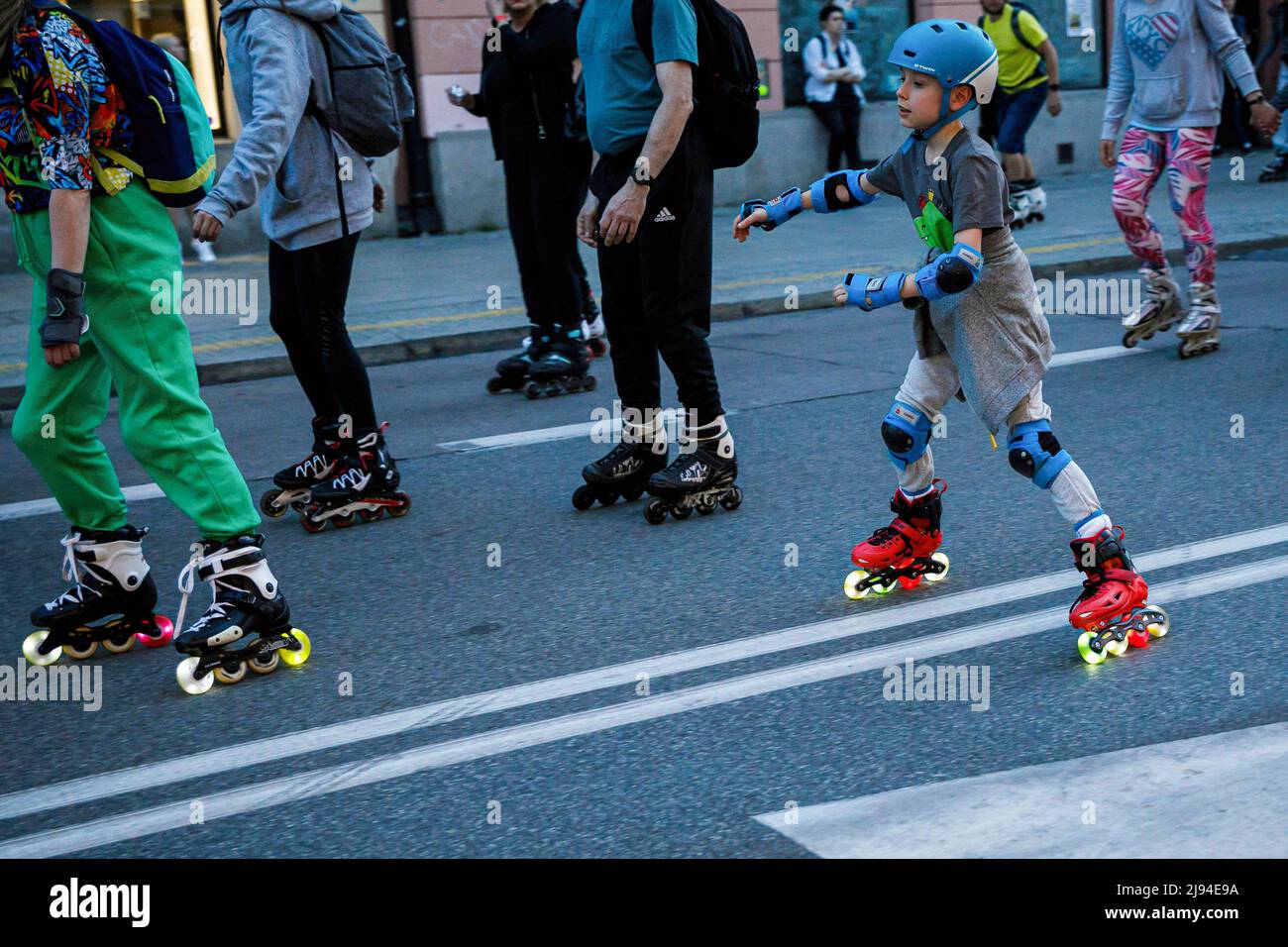 A boy wears a helmet while roller skating during the "Nightskating Warsaw"  event in the center of the city. Night skating Warsaw is a popular series  of night roller skating rides along
