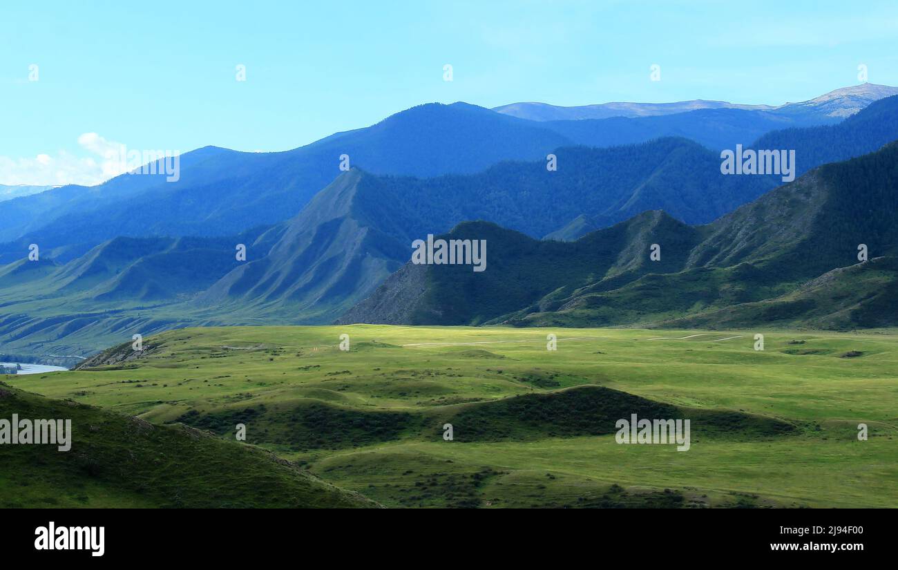 Alpine valley of the Katun River in Altai with unusual mountain ranges and mountain slopes in summer Stock Photo