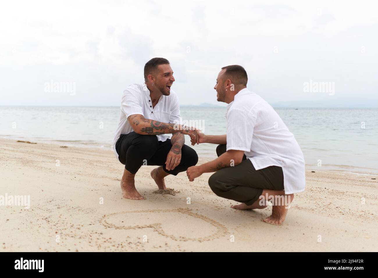 Gay couple holding hands hi-res stock photography and images - Alamy