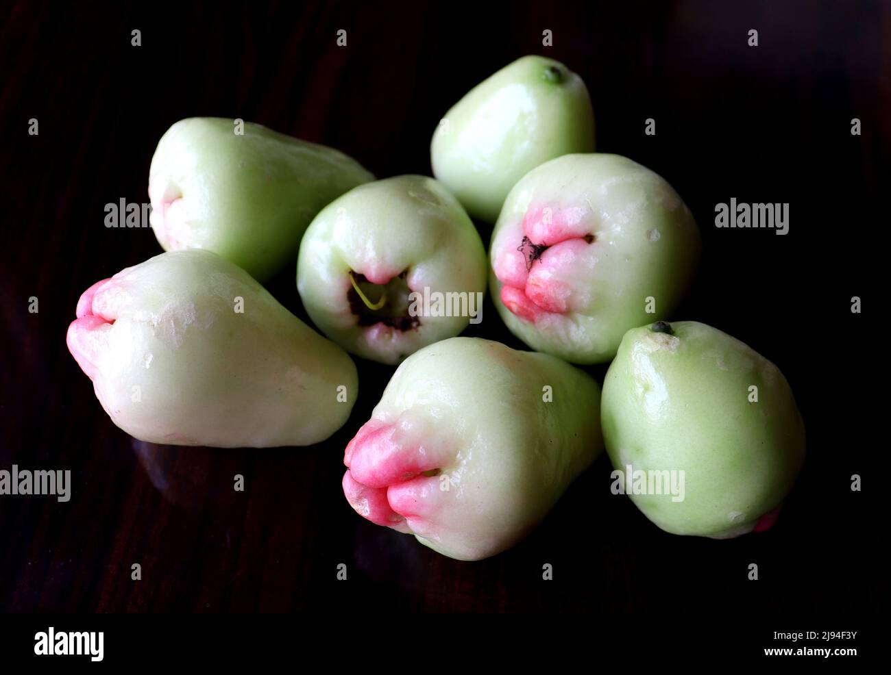 Some fresh white Wax Apples with black background,Indian summer fruit known as jamrul ,Closeup photo Stock Photo