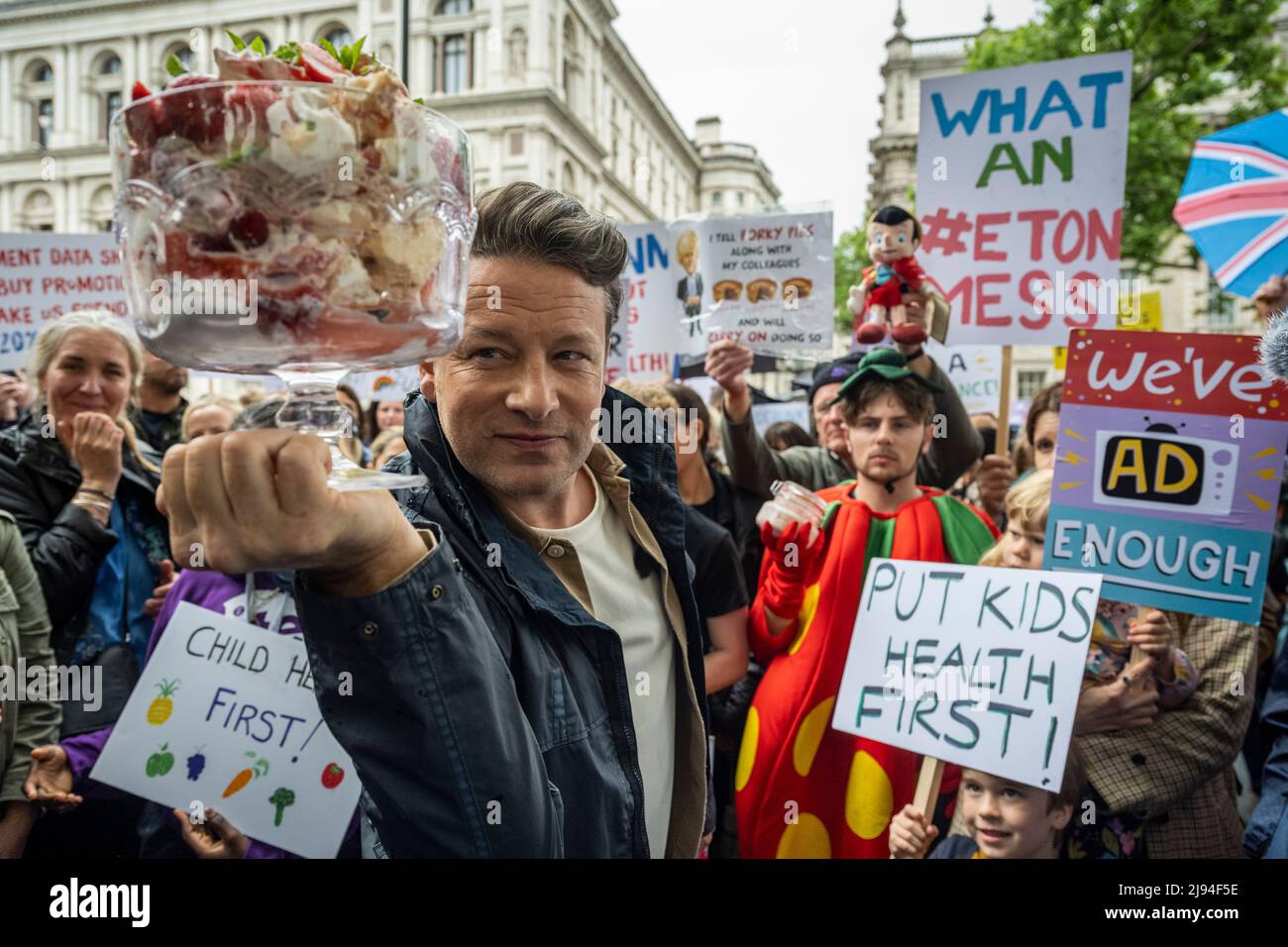 London, UK.  20 May 2022.  TV chef Jamie Oliver outside Downing Street at an Eton Mess protest.  To protect child health, protesters want the government to reverse its decision to defer for a year a ban on buy-one-get-one-free deals on unhealthy foods and a ban on TV junk food adverts before a 9pm watershed.  The government says the deferral will enable a review of the impact on budgets in the face of the cost-of-living crisis.  Eton Mess is a dessert that references where Boris Johnson, Prime Minister, went to school.  Credit: Stephen Chung / Alamy Live News Stock Photo