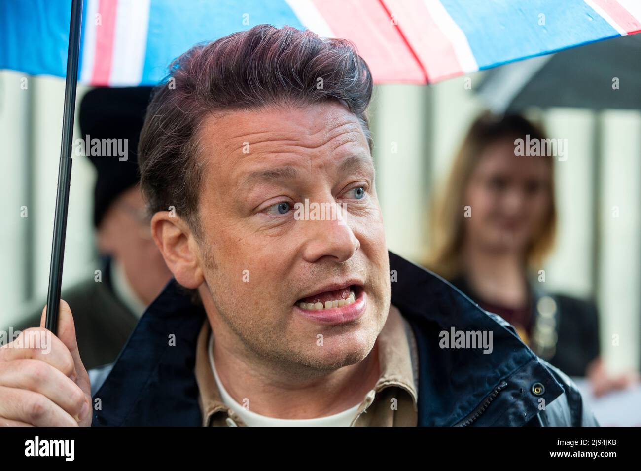 London, UK.  20 May 2022.  TV chef Jamie Oliver outside Downing Street at an Eton Mess protest.  To protect child health, protesters want the government to reverse its decision to defer for a year a ban on buy-one-get-one-free deals on unhealthy foods and a ban on TV junk food adverts before a 9pm watershed.  The government says the deferral will enable a review of the impact on budgets in the face of the cost-of-living crisis.  Eton Mess is a dessert that references where Boris Johnson, Prime Minister, went to school.  Credit: Stephen Chung / Alamy Live News Stock Photo