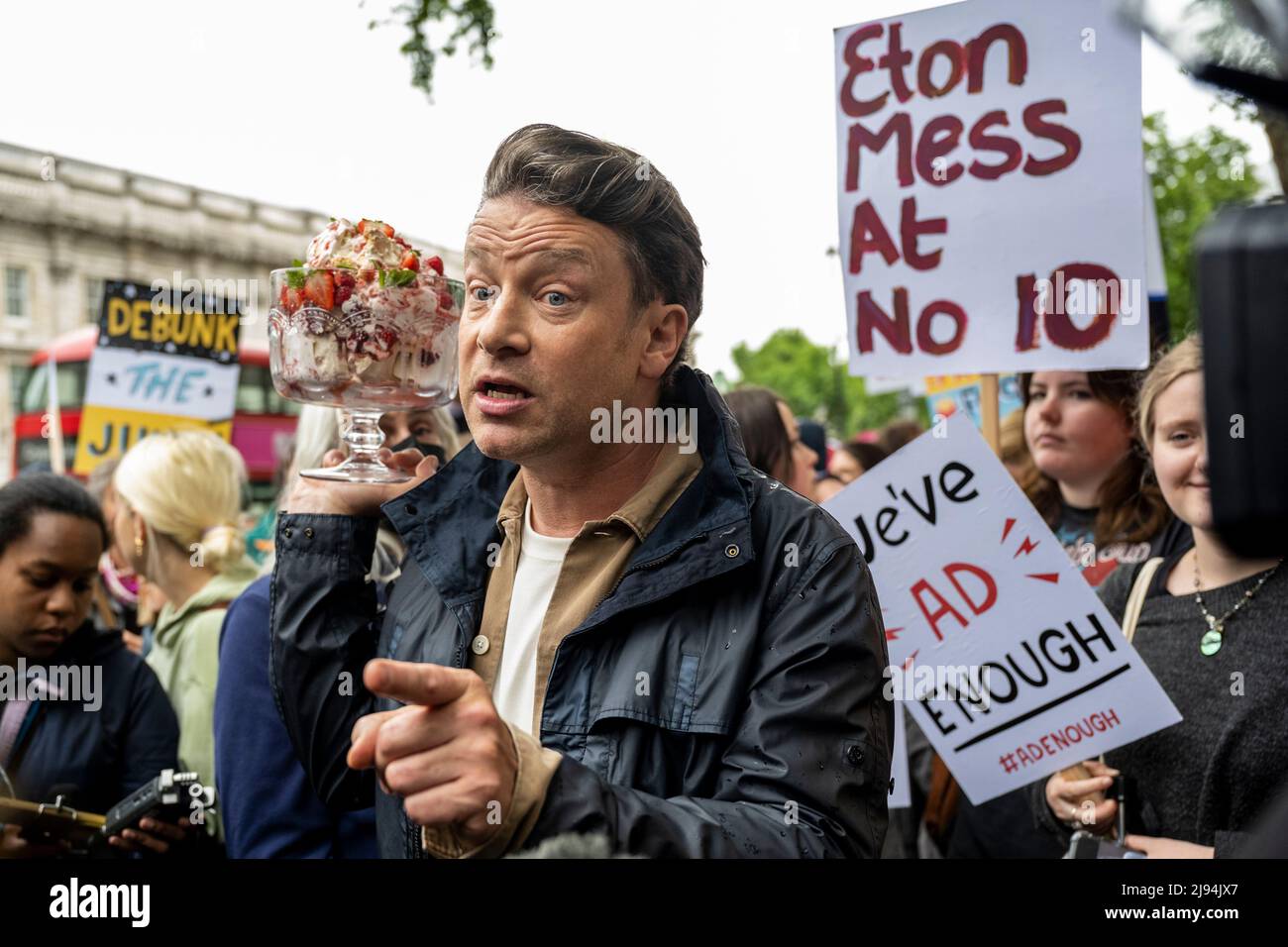 London, UK.  20 May 2022.  TV chef Jamie Oliver outside Downing Street at an Eton Mess protest.  To protect child health, protesters want the government to reverse its decision to defer for a year a ban on buy-one-get-one-free deals on unhealthy foods and a ban on TV junk food adverts before a 9pm watershed.  The government says the deferral will enable a review of the impact on budgets in the face of the cost-of-living crisis.  Eton Mess is a dessert that references where Boris Johnson, Prime Minister, went to school.  Credit: Stephen Chung / Alamy Live News Stock Photo