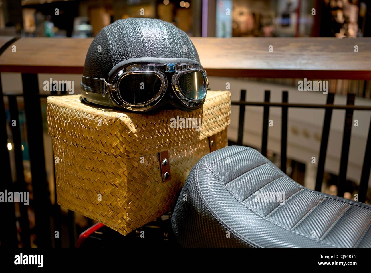 Vintage motorcycle helmet and goggles used as a prop to promote motorbike sales Stock Photo
