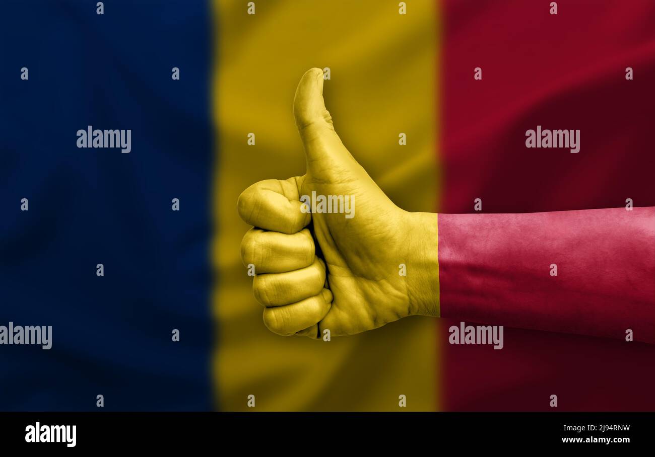 Hand making thumb up painted with flag of chad Stock Photo - Alamy