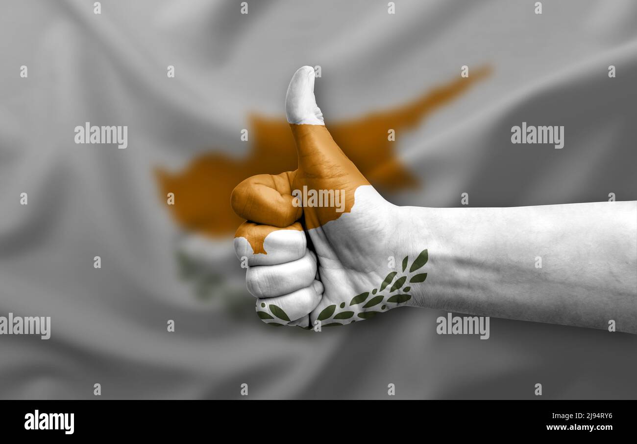 Hand making thumb up painted with flag of cyprus Stock Photo - Alamy