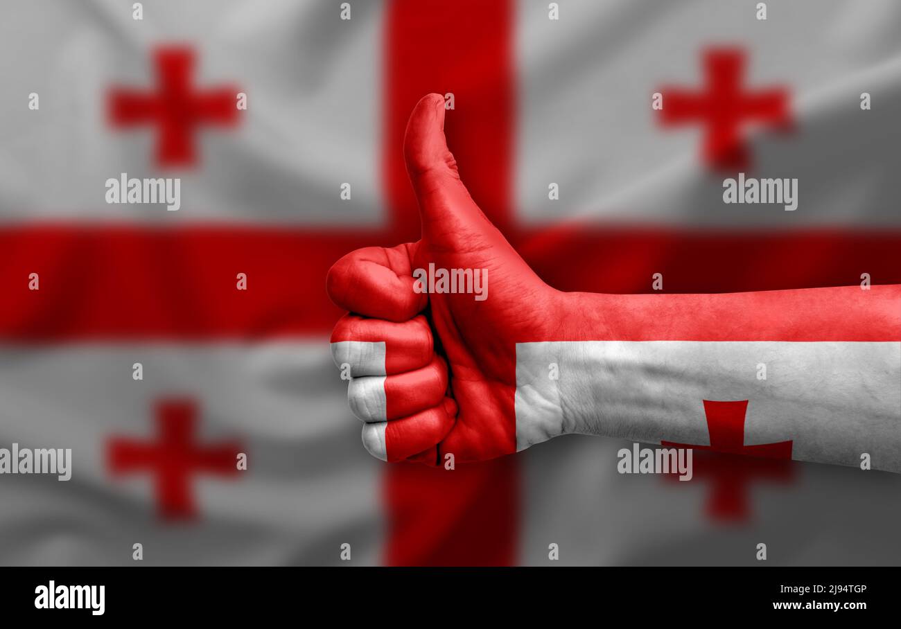 Hand making thumb up painted with flag of georgia Stock Photo - Alamy