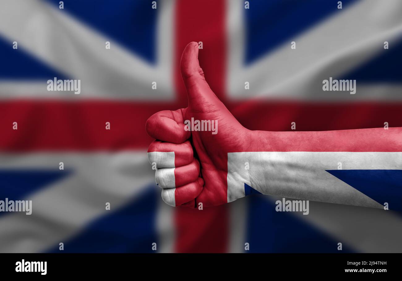 Hand making thumb up painted with flag of great britain Stock Photo - Alamy